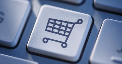 Symbolic icon of a shopping cart on a computer keyboard for online shopping